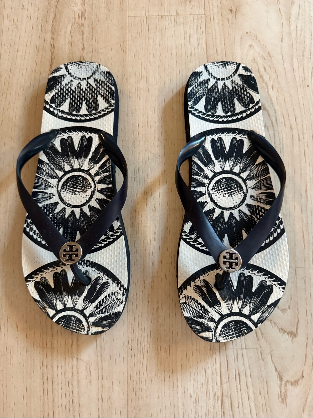 Tory Burch Black & White Sunburst Flip Flops with Logo Accent